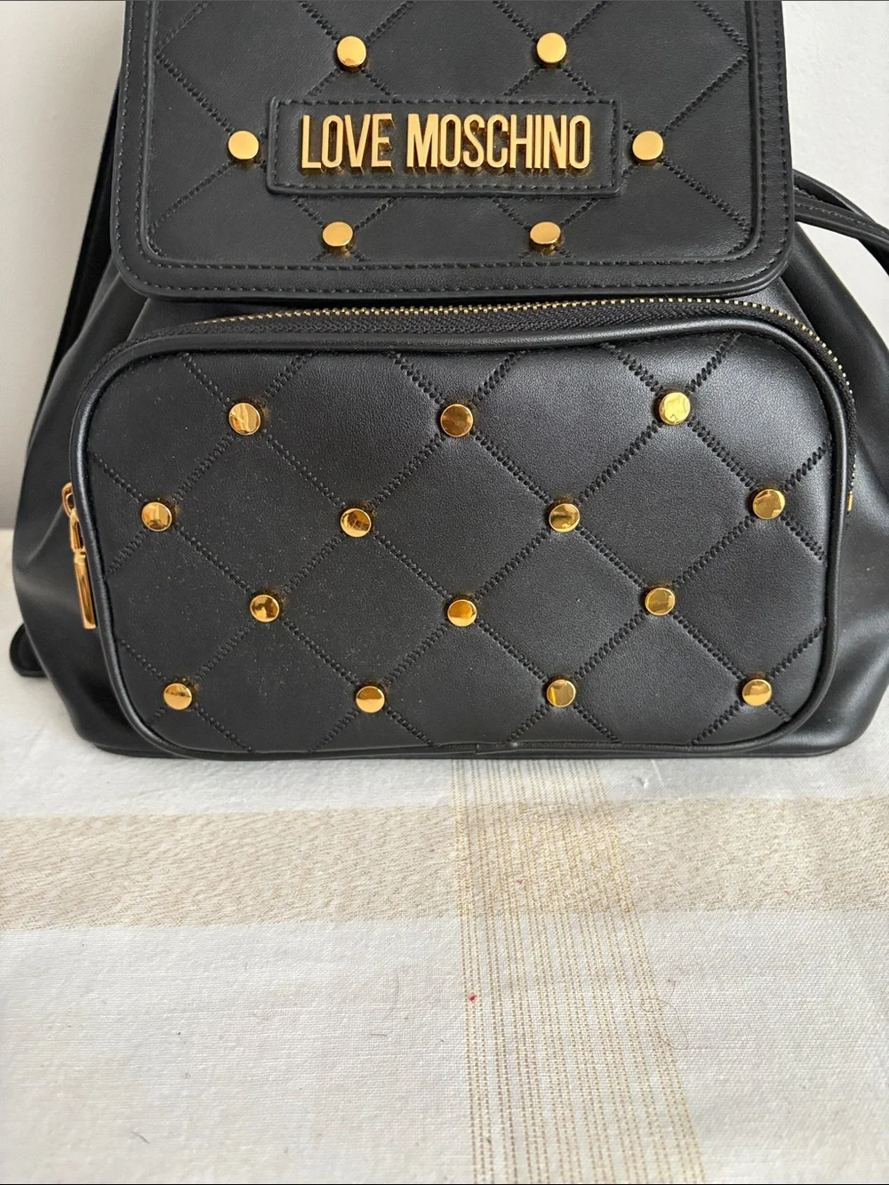 BNWOT Designer LOVE MOSCHINO Backpack, Faux Leather, with gold metal design.
